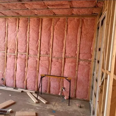 Fiberglass batt insulation in exterior wall framing